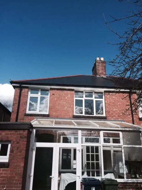 a house with a large patio and garden