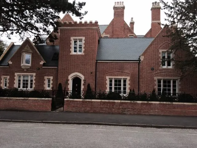 a large brick house with a large driveway