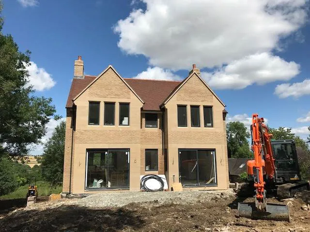 a house being built with a crane