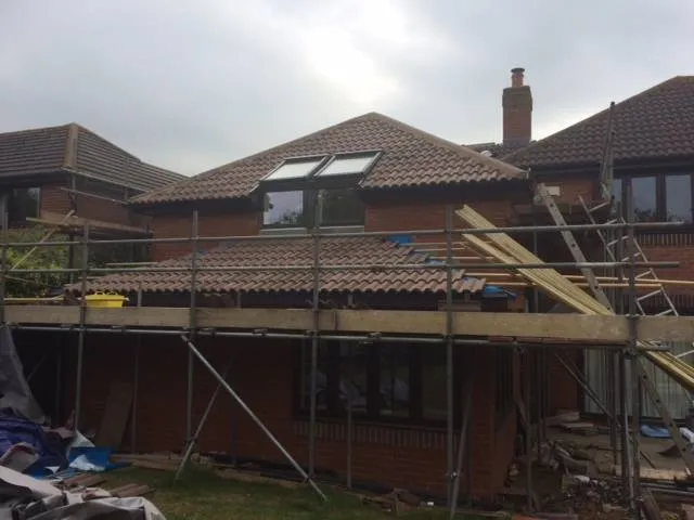 a house being built with a roof and a roofing system