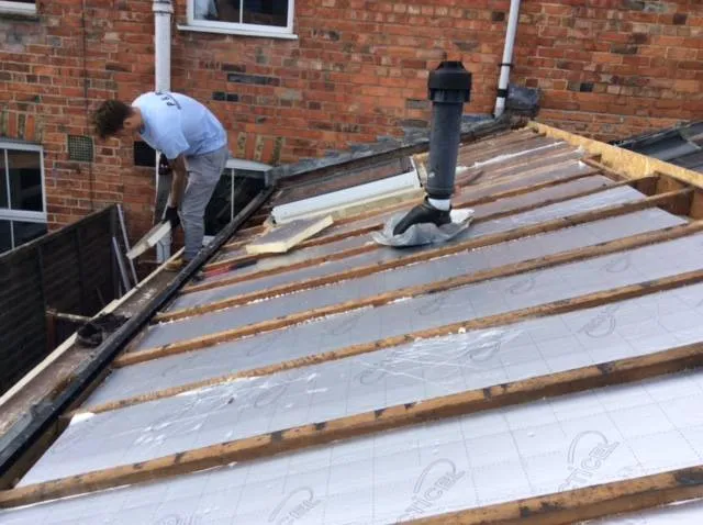 a man is working on a roof